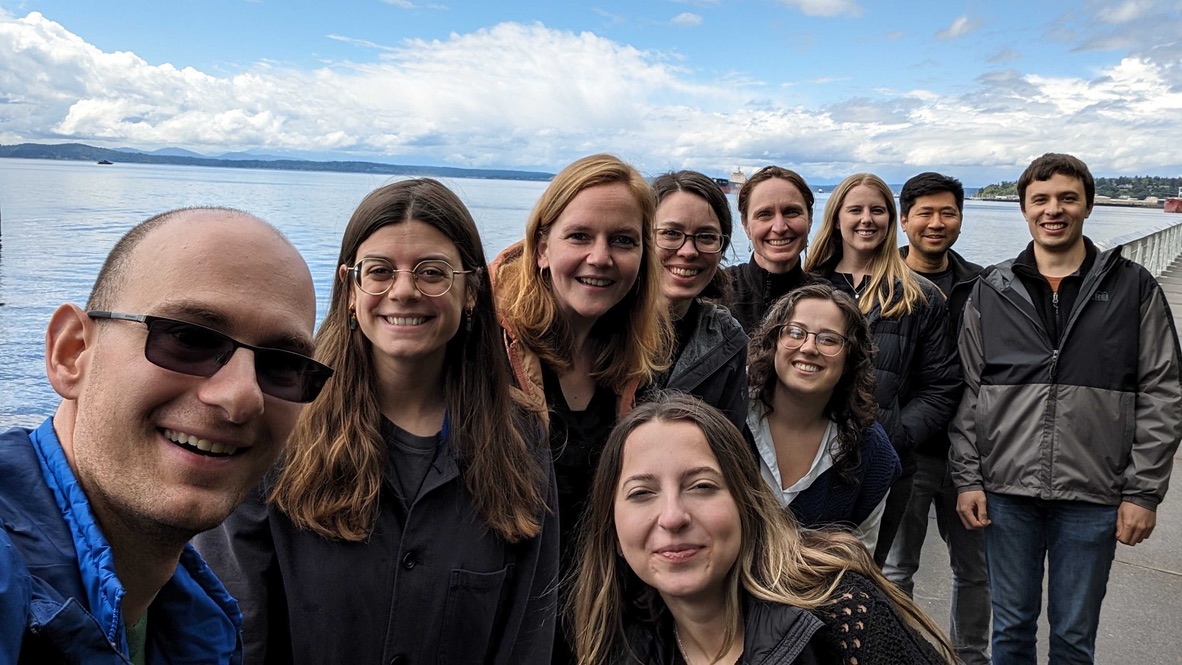 A group of people posing for a photo
Description automatically generated